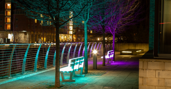 View of colourful Lumiere artwork Lightbenches overlooking the River Wear.